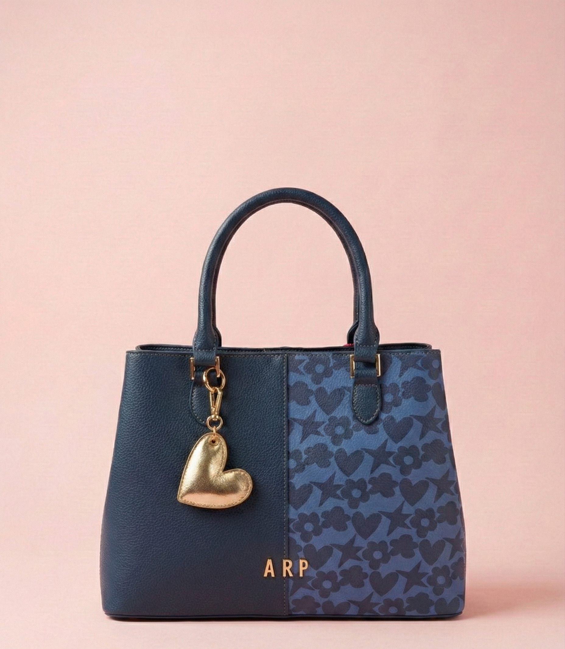 Bolso con costura central y estampado de iconos Agatha Ruiz de la Prada. azul Bolso de mano Agatha Ruiz de la Prada con diseño bicolor.