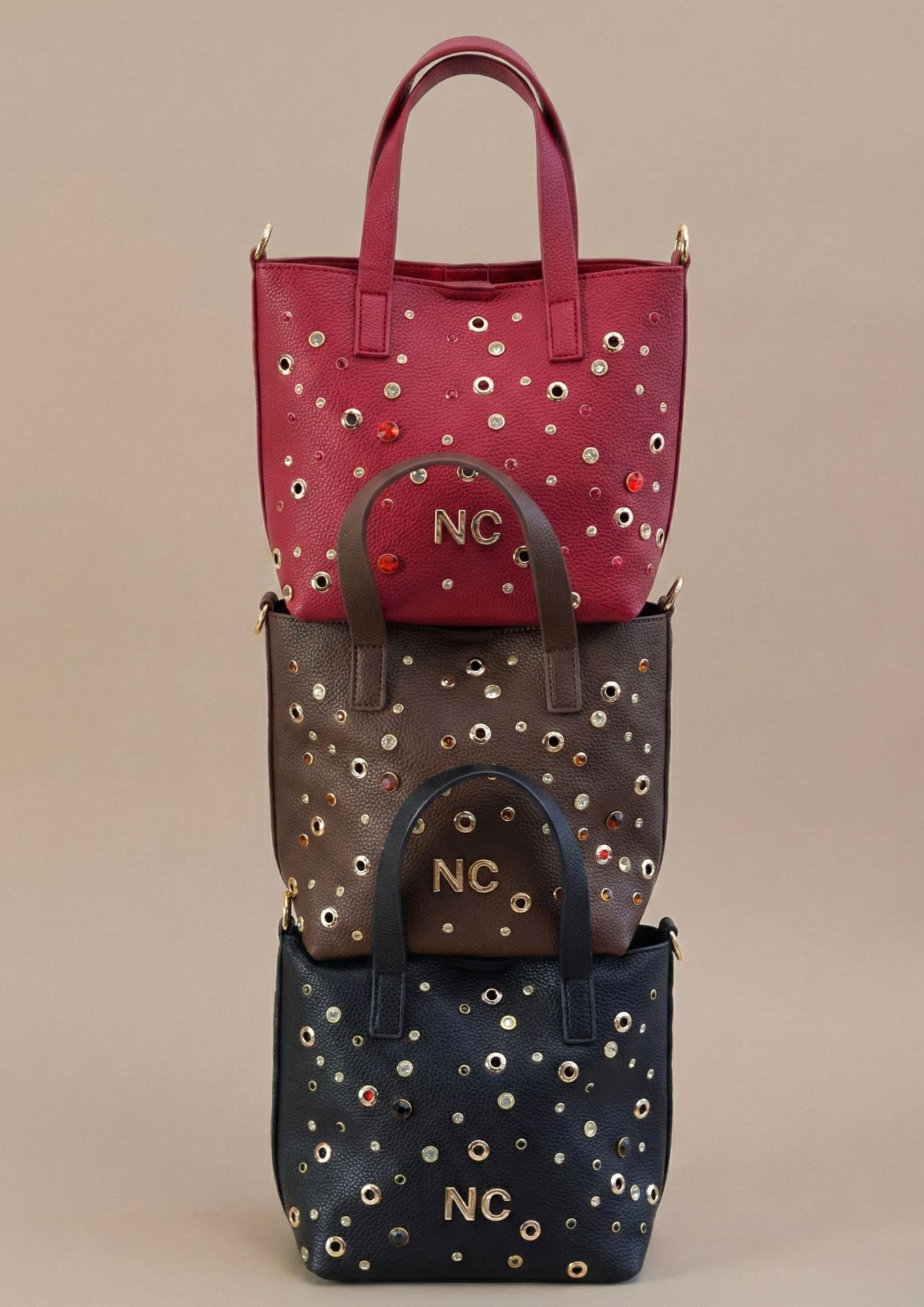 Mini bolso tipo cubo con asas superiores disponible en tres colores Mini bolso tipo cubo con asas superiores