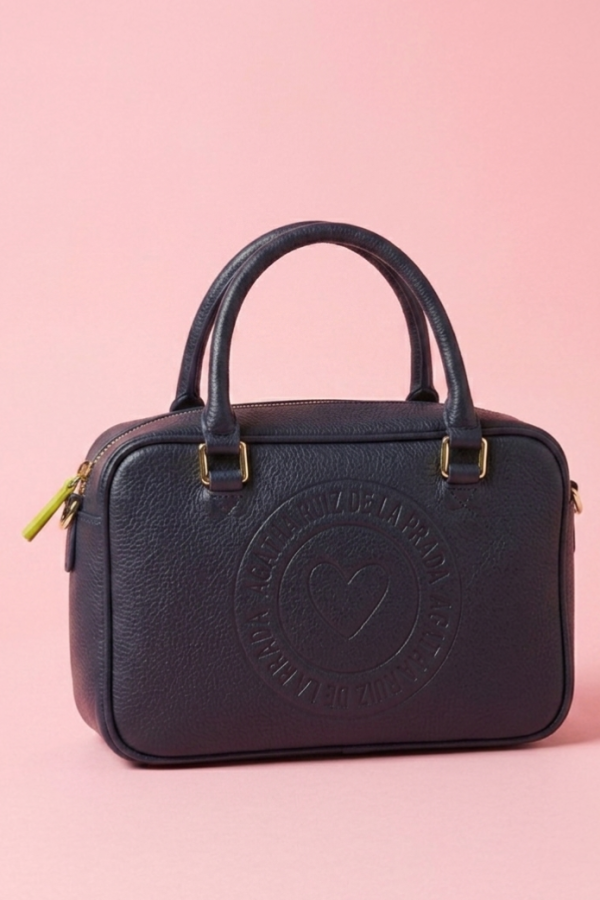 Mini bolso azul marino con asas superiores y cremallera.