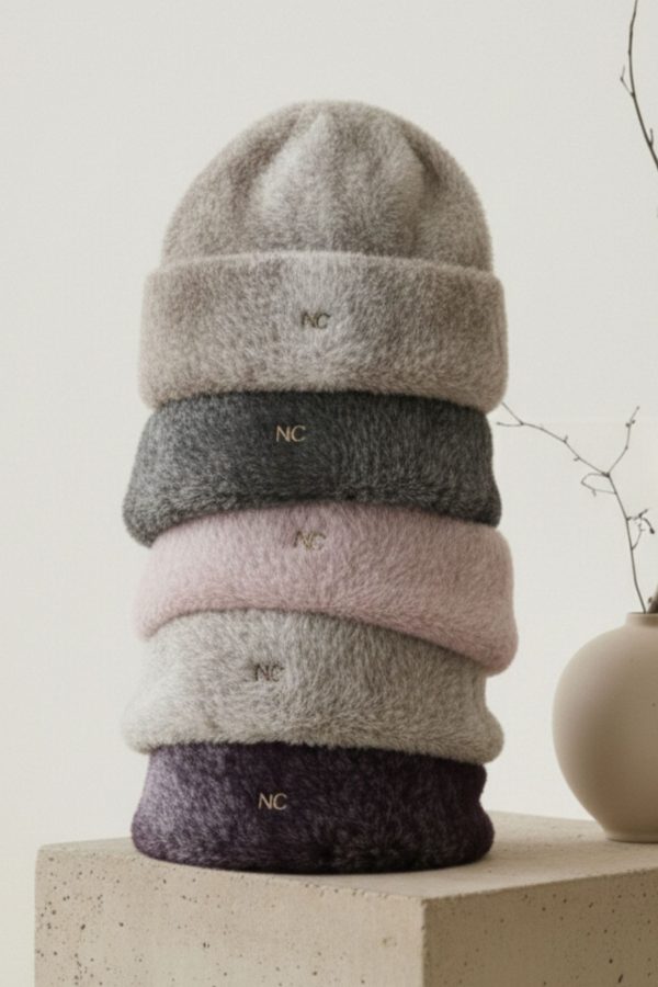 Gorro jaspeado Noco confeccionado en tejido elástico suave.